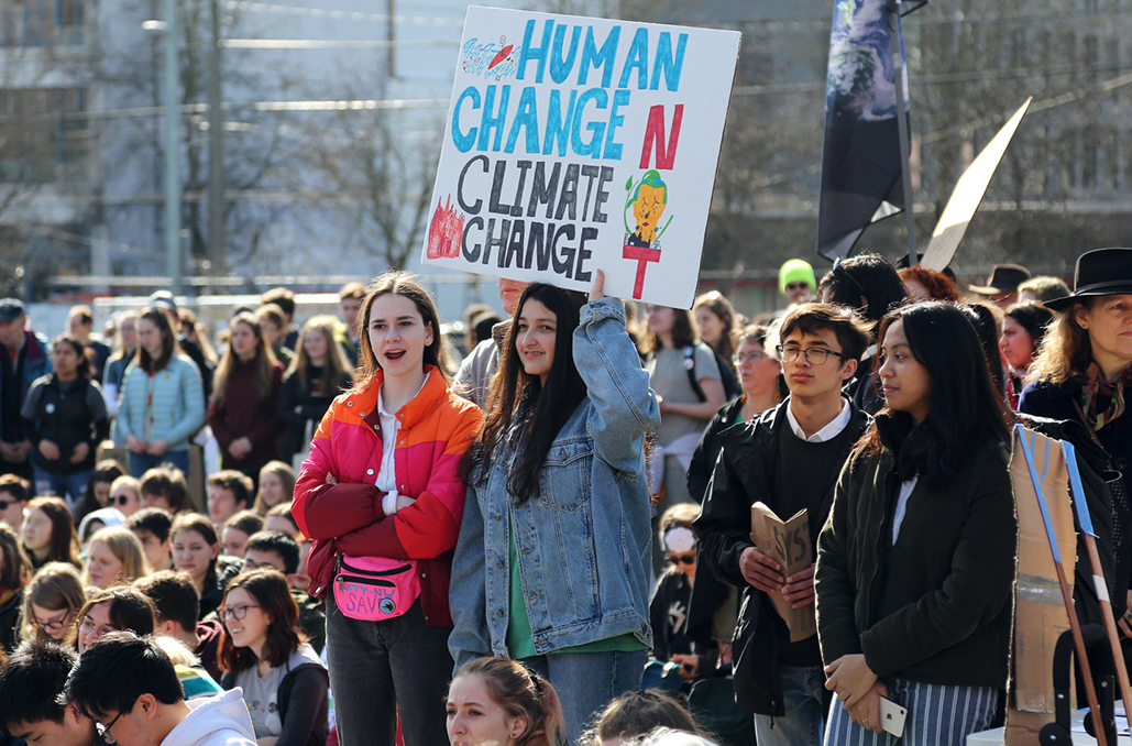 Climate protesters with signs